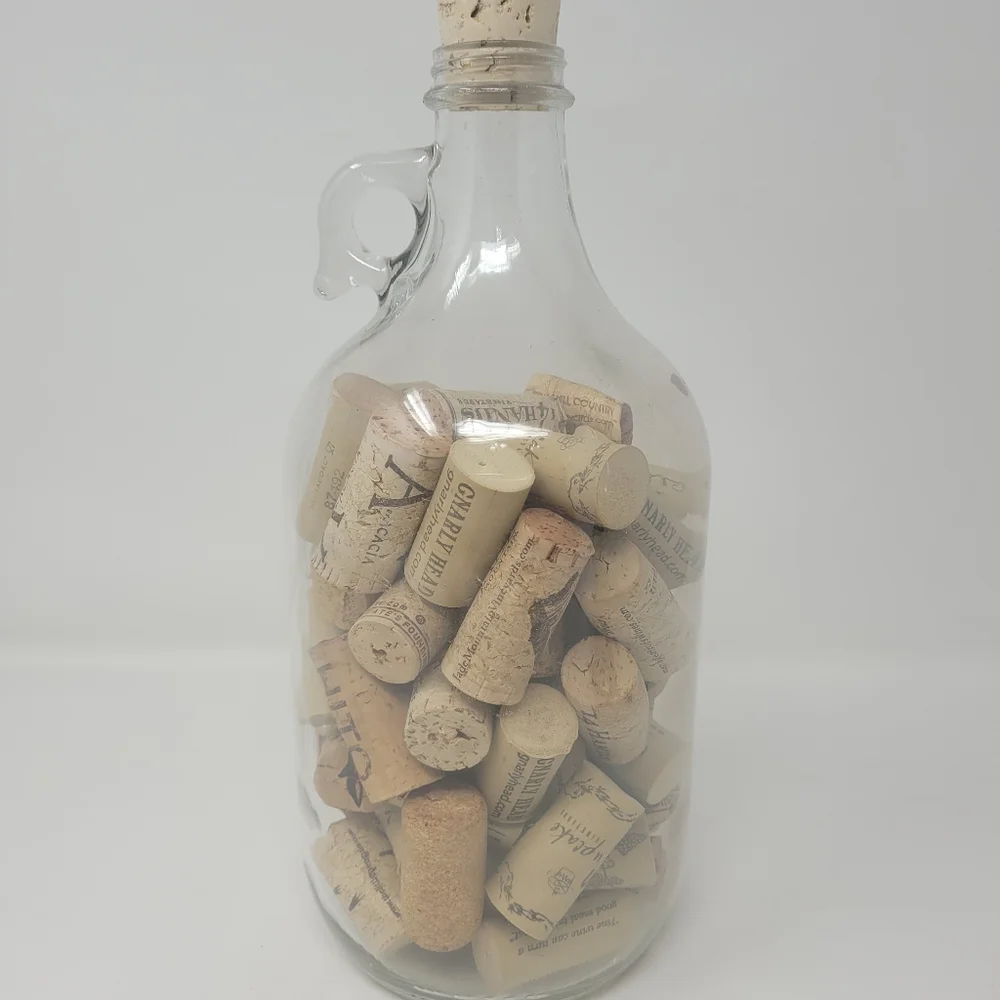 GLASS JAR OF WINE CORKS